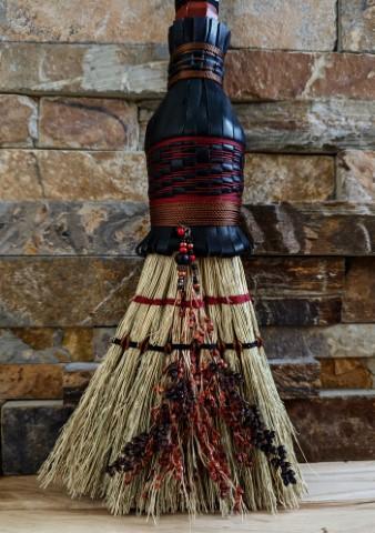 detail of broomcorn seeds, stitching, beading, leather plaiting