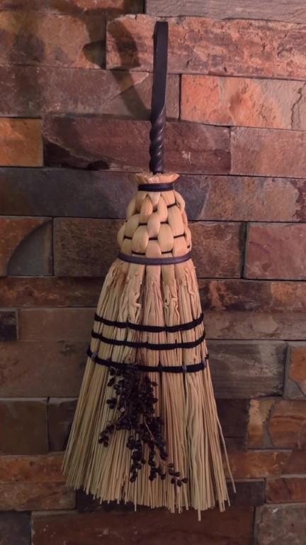 Short hearth broom with vintage metal hook, natural broomcorn fibers, three rows of stitching and seed details