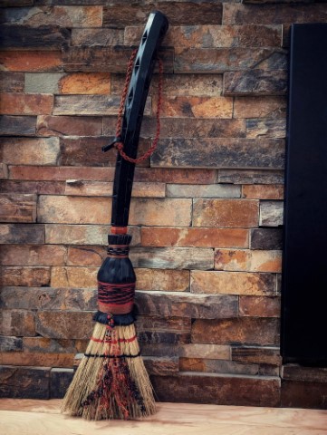 Hearth broom by Sorghum & Leather and Ulver Crafts - black carved handle and leather plaiting